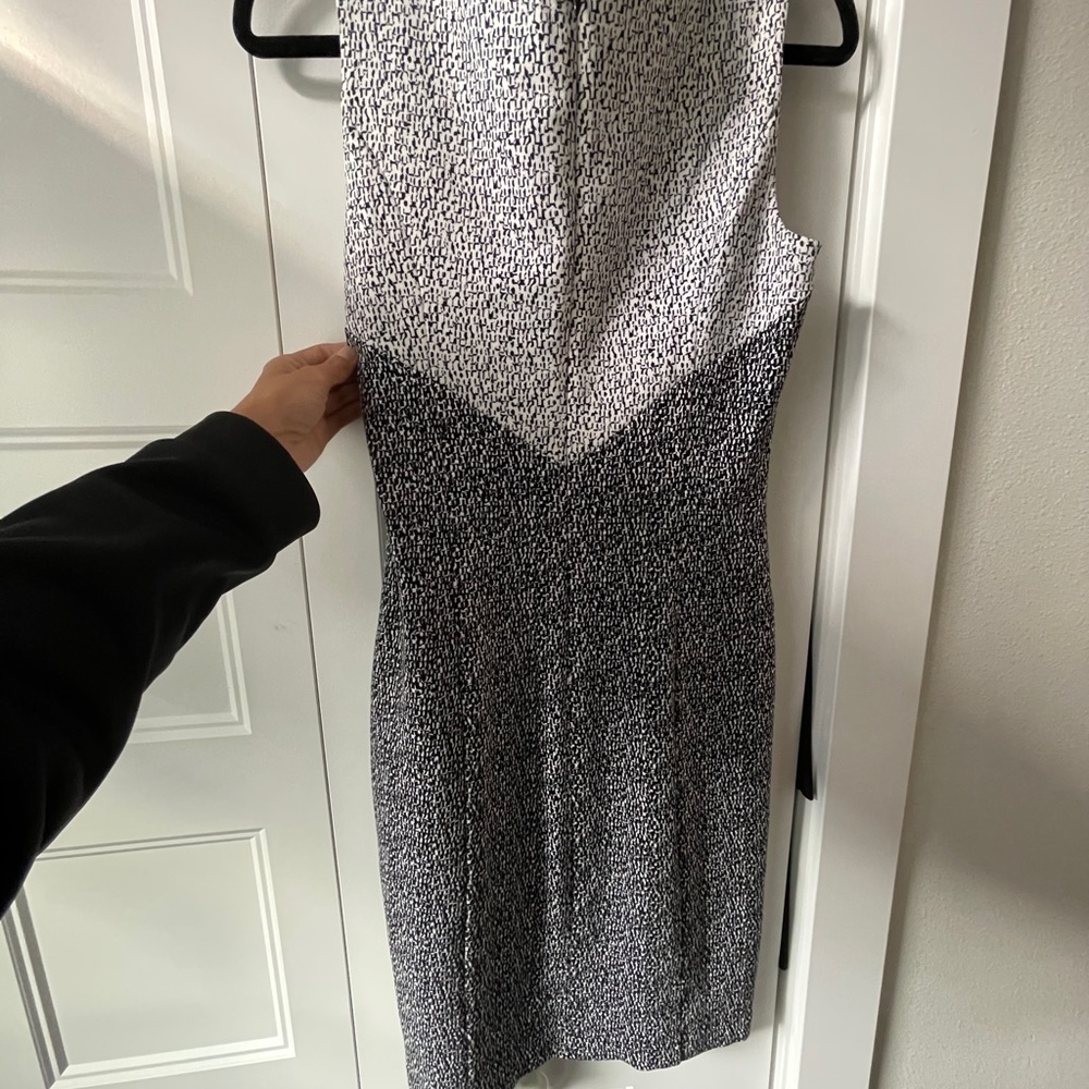 NWOT White House Black Market Size 4 black and white v-neck sleeveless dress.